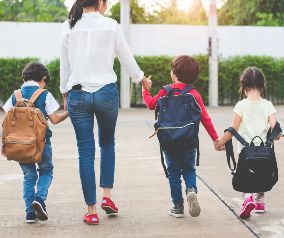 Parent walking children to school